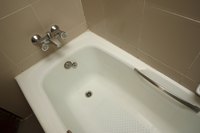 Make your shower simpler to access by installing a bathtub step-through conversion kit.