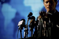 A man gets ready to give a speech