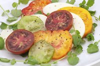 Black tomatoes often show dark color in the gel sacs around seeds.