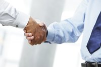 Image of two businesspeople shaking hands.