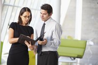 Business people looking at notes.