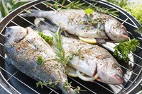 Fish being cooked on barbeccue