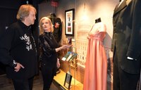 Onlookers admire one of Cash's black ensembles at the Johnny Cash Museum in Nashville.