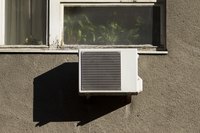An apartment unit with window mounted air conditioner.