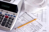 Calculator on top of tax papers