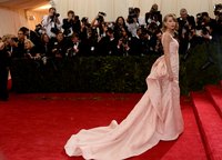 Form-fitting and draped satin makes a glamorous statement.