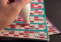 Outside pockets keep bingo daubers in easy reach.