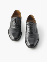 Creases may appear on the toe and "vamp" of a shoe.