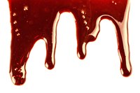 Strawberry and chocolate syrups team up for fake blood.