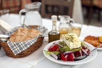 Serve Greek country breads with a traditional salad and oil for dipping.