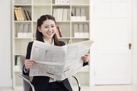 Woman reading the newspaper