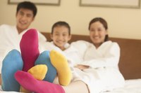 Family wearing multicoloured socks.