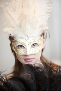 Use paper-mache to create a carnival mask for a masquerade ball.
