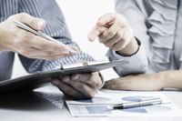 Looking over financial reports.