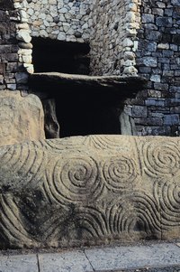 Swirling designs decorate the interior stones of Newgrange, the oldest structure in Ireland.