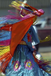 Fringed shawls add to the drama of Native American dance.