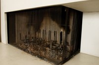 A cast-iron grate that is black and clean refreshes the look of a fireplace.