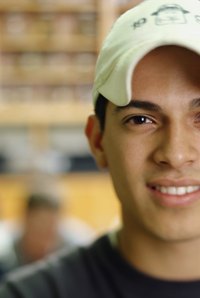 A man is wearing a low profile cap.