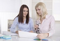 Two female employees talking to each other