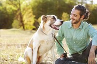 Owner sitting outside with dog