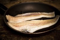 Two haddocks in frying pan