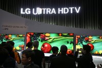 Consumers looking at LG television display.