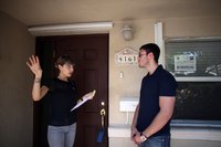 A realtor walking a buyer through a home.