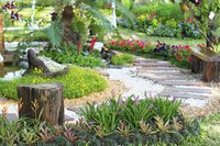 A path of stones winding through a garden.