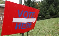 Close-up of voting sign.