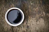 Small container of balsamic vinegar.