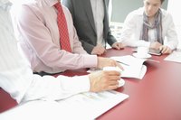 Business people going over documents.