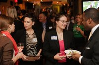 Guests attending an event to raise funds for business growth in a city.