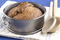 Dark baking pan with cake inside
