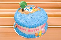 Coconut adds texture to a beach-themed 60th birthday cake.