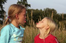The Rude Child's Behavior of Sticking out the Tongue