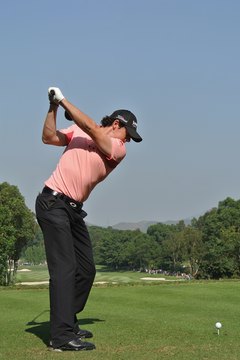 With his hands moving above his right shoulder, Rory McIlroy is on the proper swing plane during the 2011 Hong Kong Open.