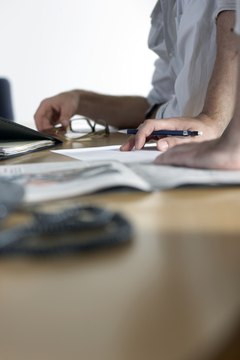 Carefully review cards' policies to ensure they will not appear on your personal credit report.