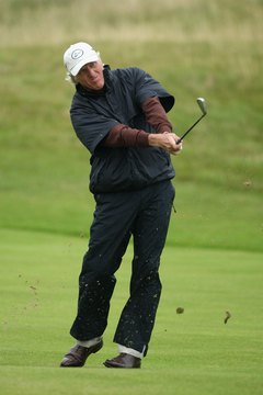 Even this far into his finish, Greg Norman's back knee stays bent so that his back foot doesn't slide.