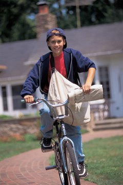 Newspaper boy riding bike