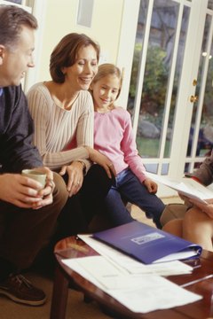 Parents and daughter (10-11) with financial advisor