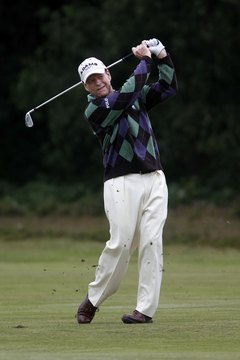 One reason Tom Watson takes a smooth, consistent swing is that both of his knees remain gently flexed.