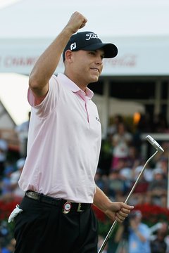 Bill Haas won the Tour Championship in a playoff over Hunter Mahan, giving him the FedExCup's $10 million top prize.