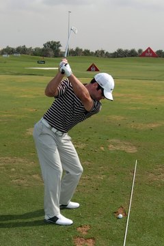 Paul Casey uses alignment aids during practice (here, a string tied to two tees) to help him become more consistent.