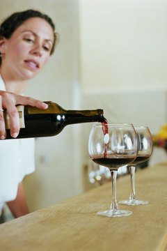Bartender pouring wine into glass