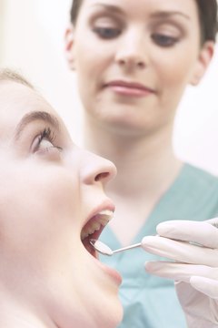 Dental hygienist and patient