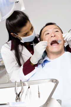 Dentist performing procedure on patient