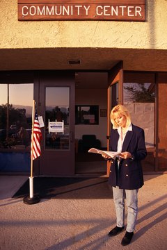 Woman reading in front of community center
