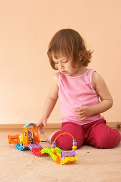 Use different and exciting objects during floor play.