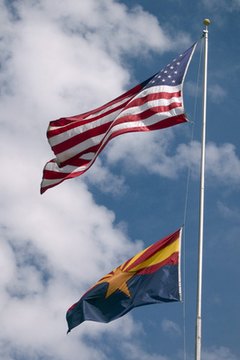 Arizona state flag, below the U.S. flag.