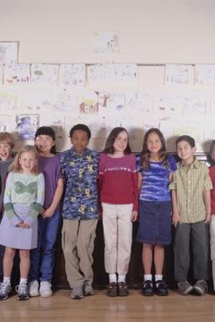 tweens in fron of classroom wall